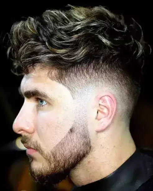 Add Volume To Your Hair With A Fresh Twist Brushed Forward Wavy Hair With A Low Taper, Sharpened Jawline By A Well Groomed Beard!