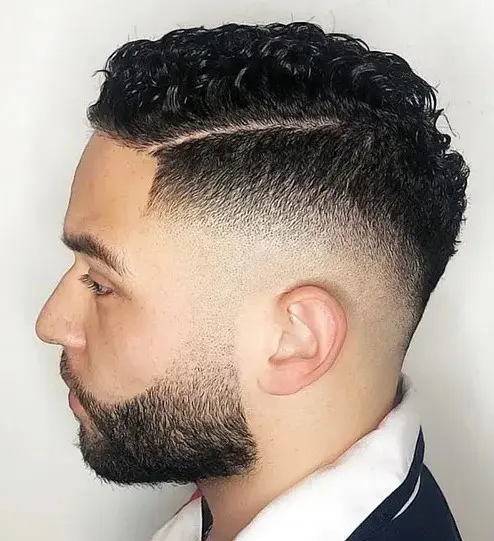 Cool Curly Drop Fade, Side Part Tamed Yet Stylish.
