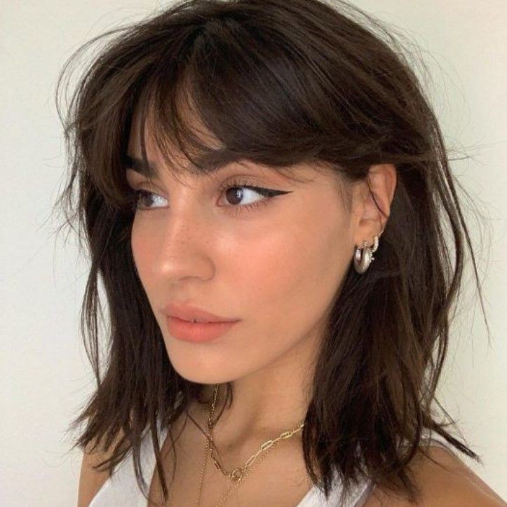 Get Chic With Messy Bangs For Weightless Thick Hair.