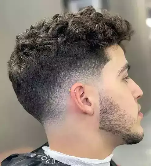 Let Your Teture Shine With A Classy Low Drop Fade For Your Curls, While Adding Some Intrigue With A Beard!