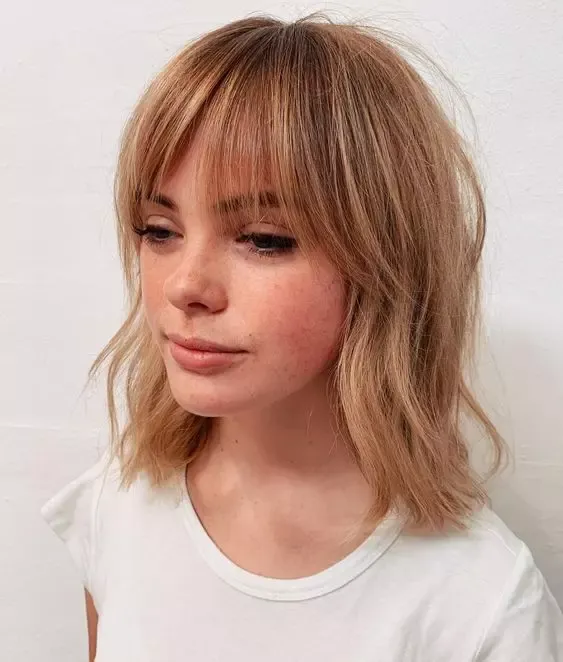 Try Relaed Waves And Bottleneck Bangs For Stunning Copper Hair.
