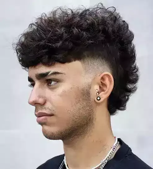 A Curly Mohawk With A Fade Is A Super Bold Rock Style