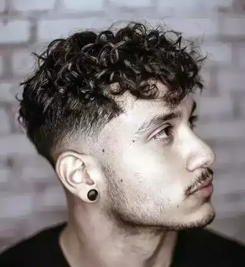 Messy Curly Hair With A Tape Fade Is A Creative Take On Classics