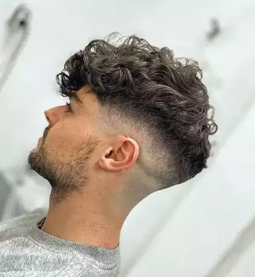 Thick Curly Hair With A Mid Bald Fade With A Clean Cut Finish