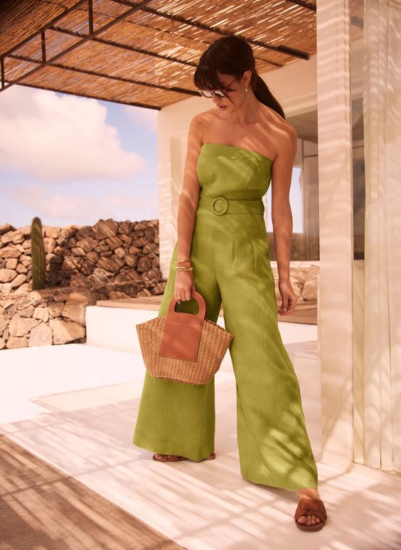 A fab neon green linen strapless jumpsuit brown sliders and a straw bag for a beach or coastal shower
