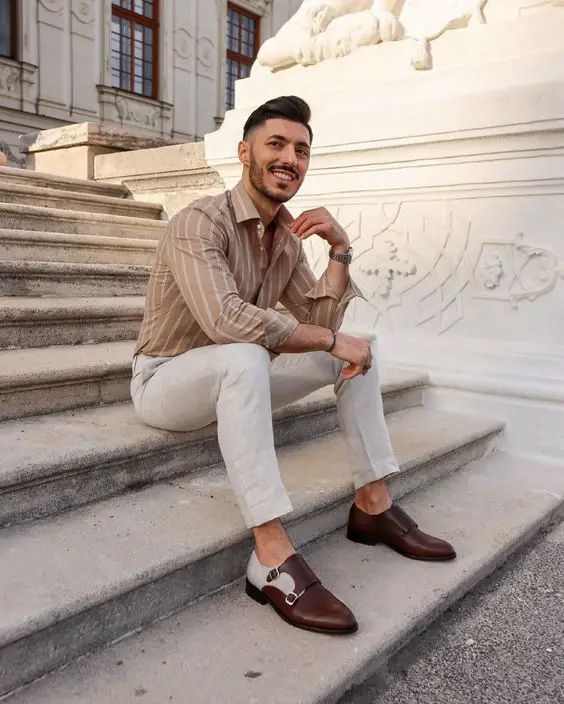 A neutral outfit with a beige striped shirt creamy pants brown shoes is great for summer days