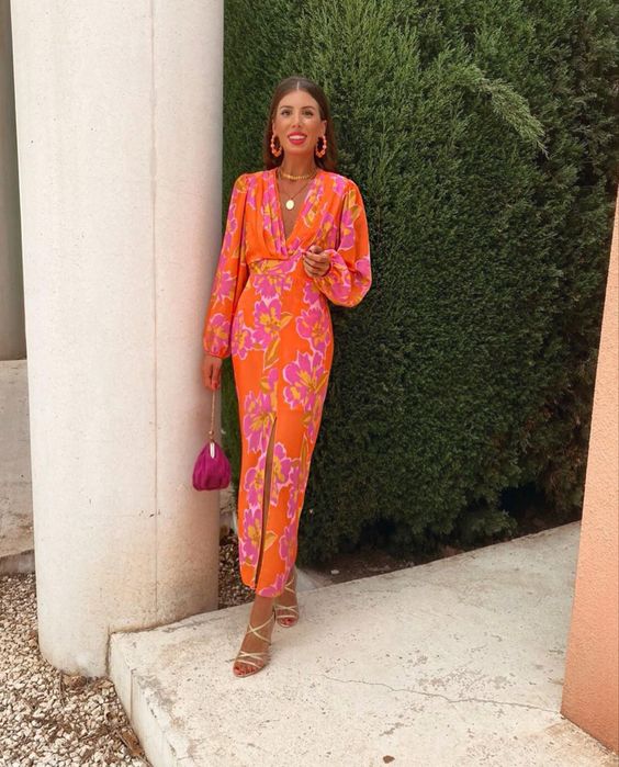 This bold orange maxi dress with a pink floral print and front slit lace up metallic shoes and a fuchsia bag is great for a bridal shower