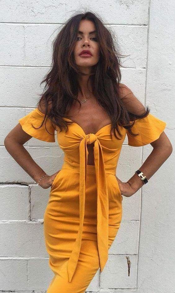 This gorgeous mellow yellow off the shoulder dress with a knotted bodice is a sexy piece for a summer party