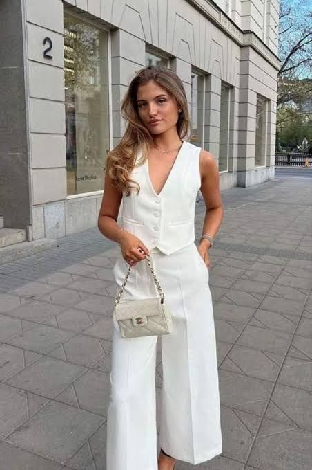 an Old Money outfit with a vest wideleg pants a creamy bag and some accessories is chic
